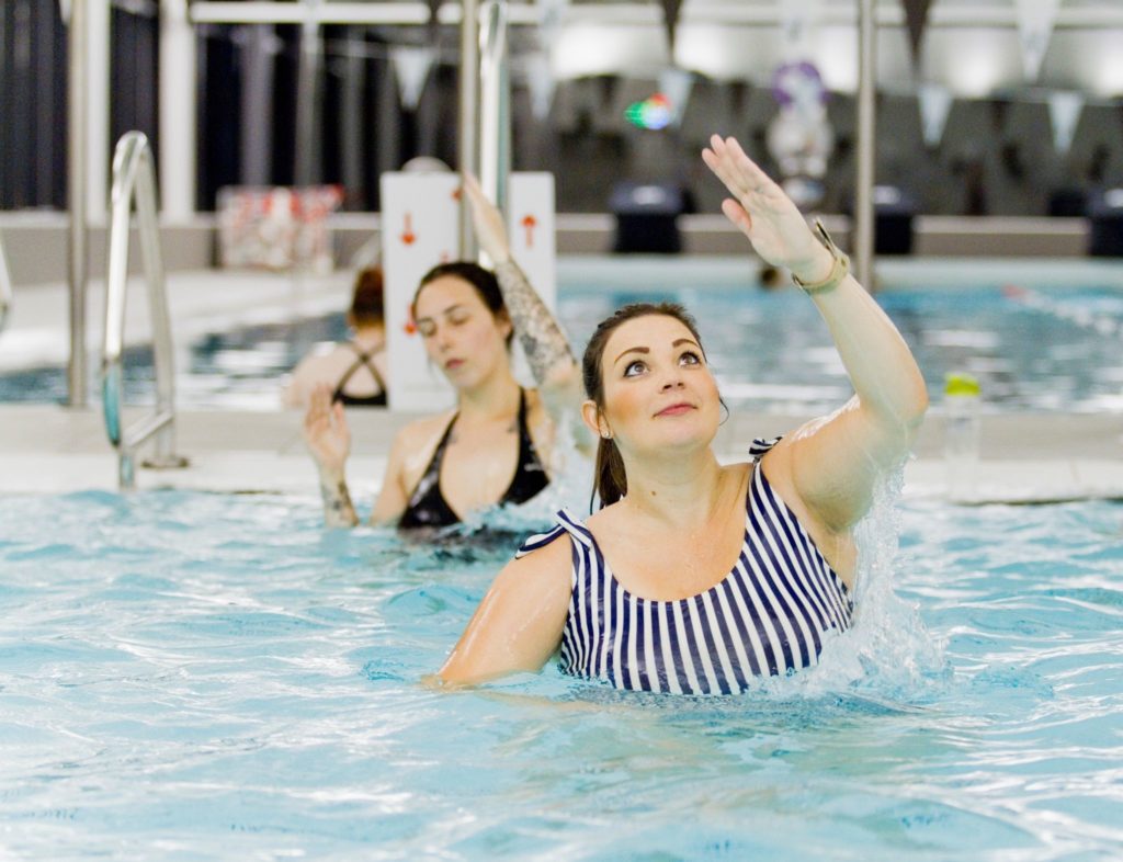 Pregnant women enjoying water based exercise